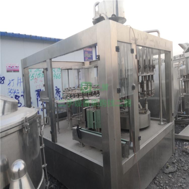 出售九成新二手沖灌封三合一機 全自動三合一灌裝機 果汁飲料灌裝機