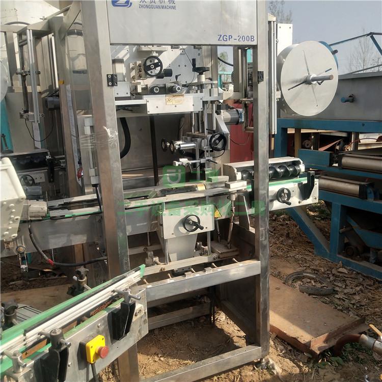 出售全自動套標機二手果汁飲料套標機二手礦泉水套標機熱收縮套標