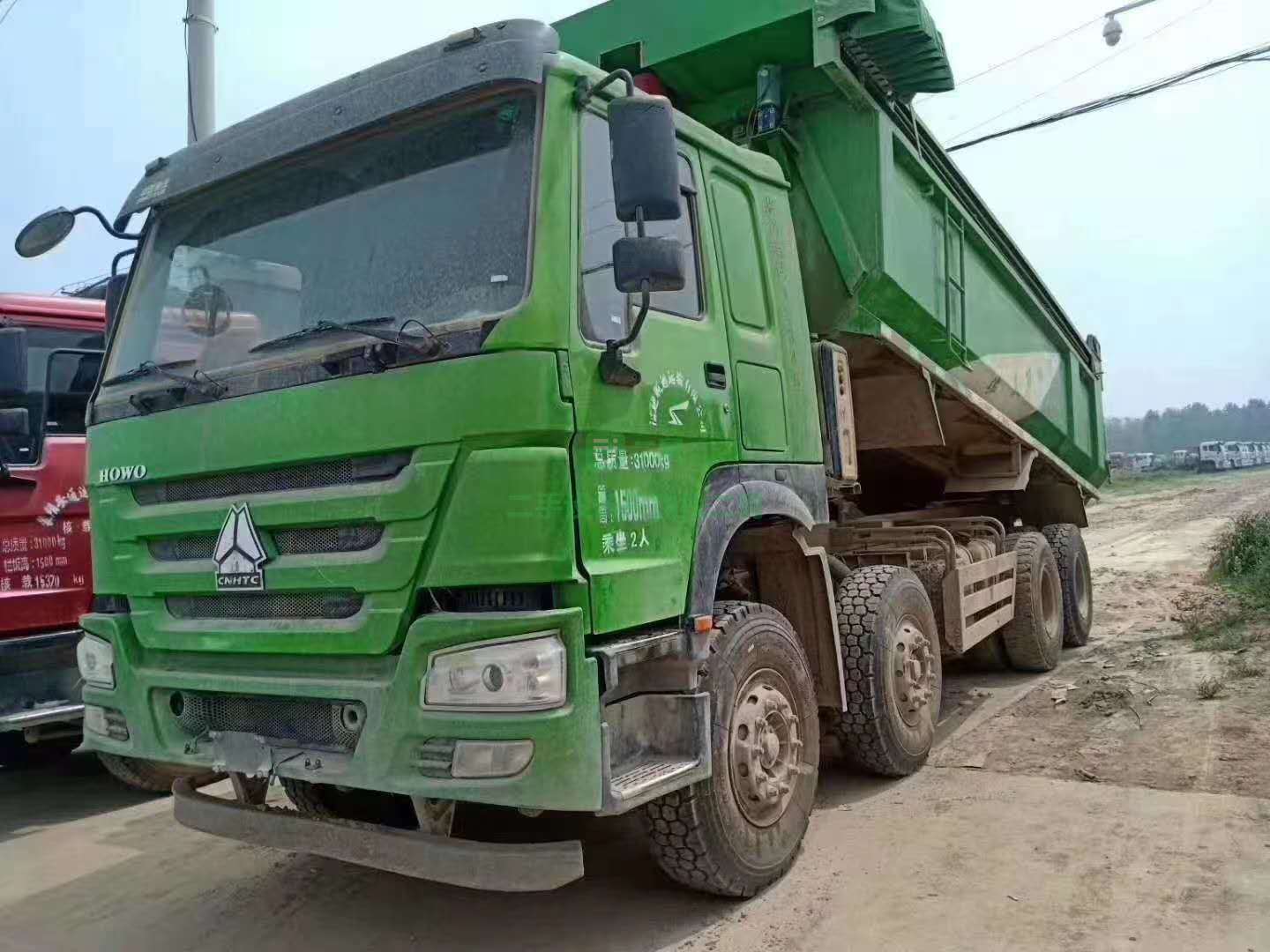 出售七臺18年6月國五豪沃前四后八自卸車，大箱6.8米，箱高1.5米，法規環保綠，首付6萬