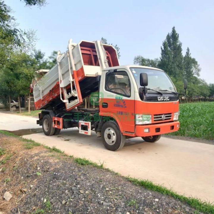 出售18年的東風(fēng)多利卡推鏟式掛通垃圾車