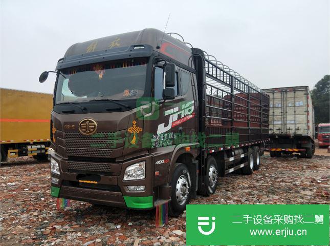 江蘇出售二手青島解放JH6重卡400馬力9.5米倉柵式載貨車