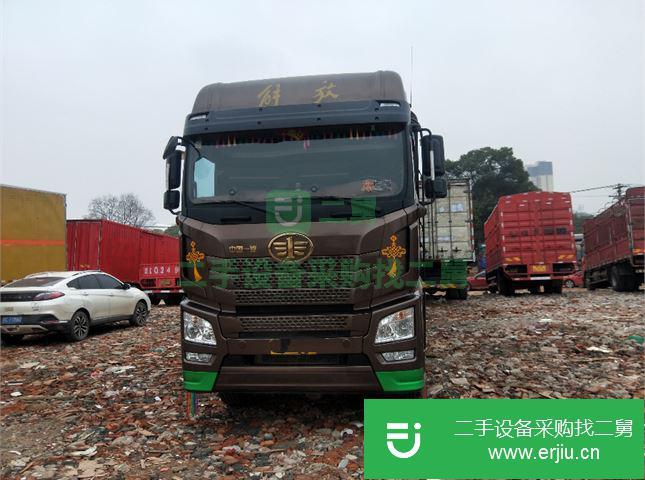 江蘇出售二手青島解放JH6重卡400馬力9.5米倉柵式載貨車