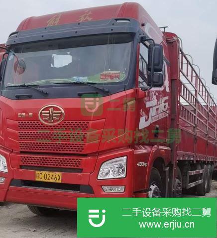 江西出售二手青島解放JH6重卡430馬力倉柵式載貨車