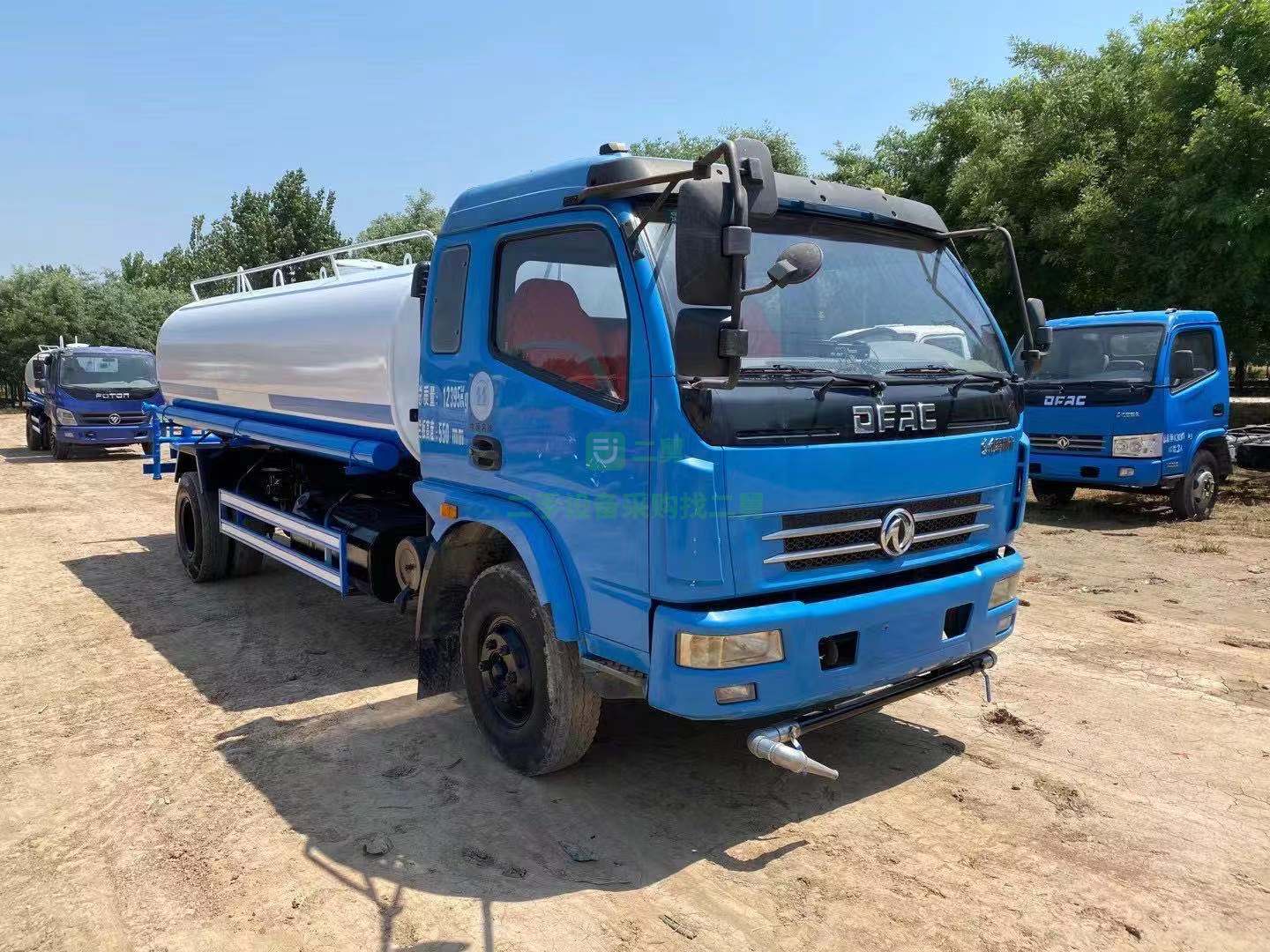 出售東風(fēng)多利卡10立方二手灑水車全新罐體和龍王水泵